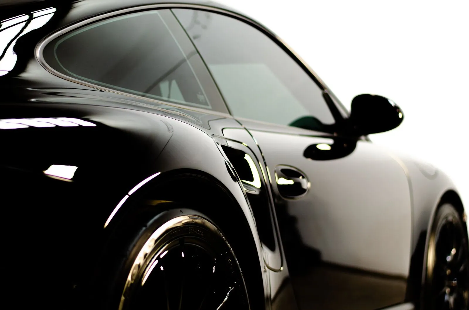 Black Porsche 911 mirror finish detail