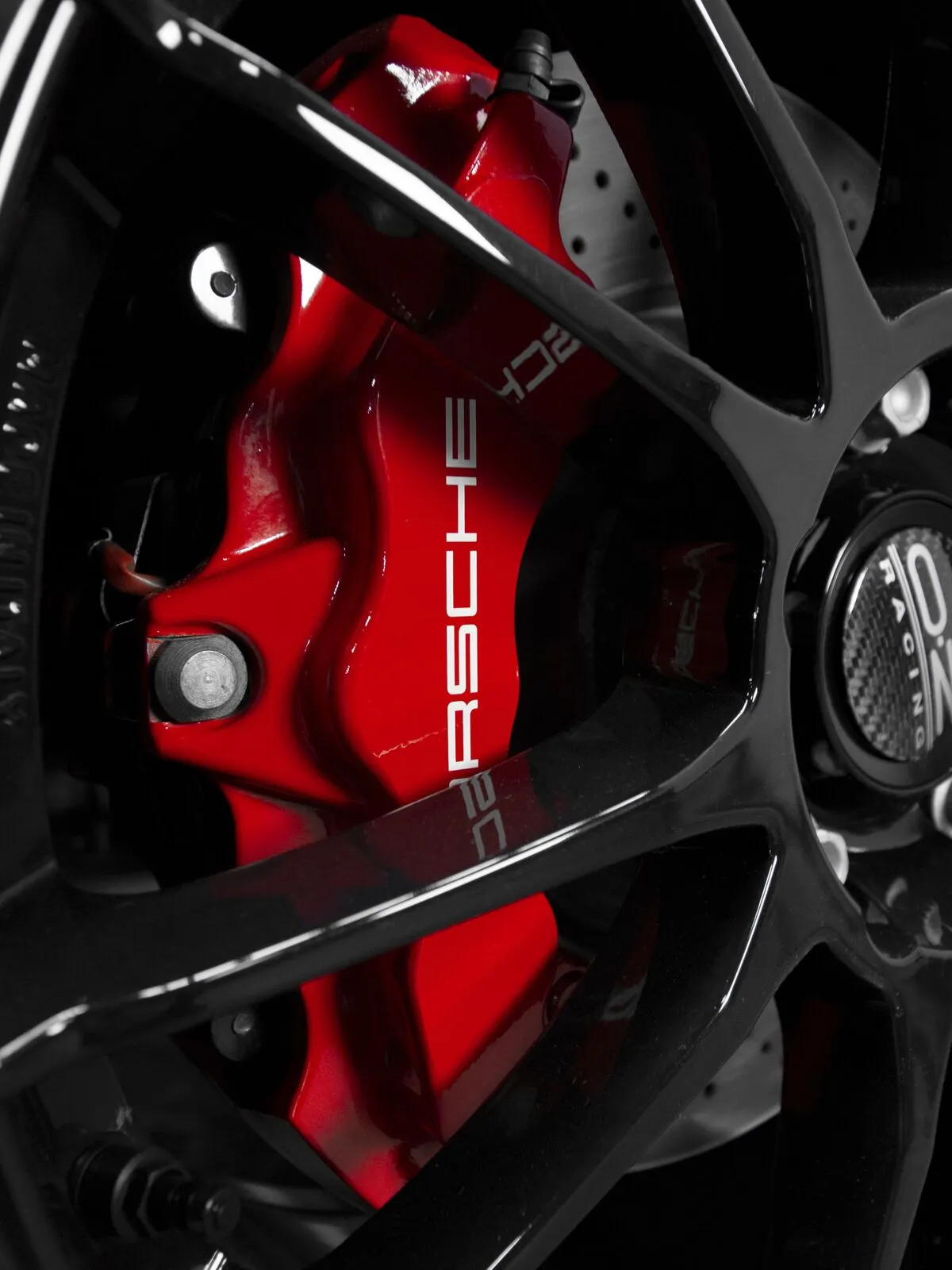Porsche red caliper and wheel detail