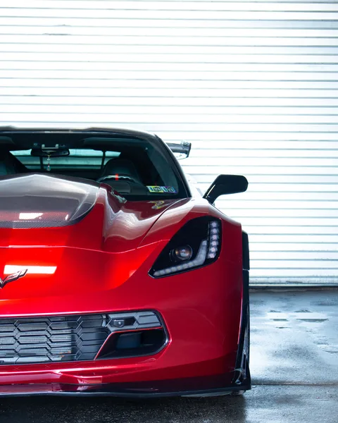 Red wrapped Corvette Z06 front headlight detail