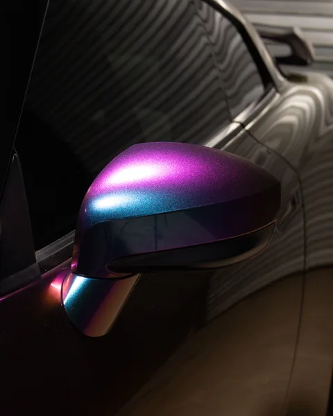 Color-shift vinyl wrapped side mirror showing purple to teal transition